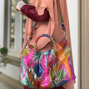 May include: A set of three ceramic mugs with a speckled, matte finish in cream, light grey, and dark grey. Each mug has a simple, minimalist design, suitable for coffee or tea.