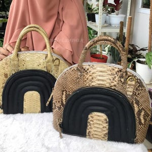 May include: A set of three ceramic mugs with a speckled, matte finish. Each mug is in a different colour: light blue, cream, and grey. The mugs have a simple, modern design with a rounded shape and a comfortable handle.