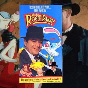 May include: A VHS tape for the movie "Who Framed Roger Rabbit" featuring the film's title in yellow and red, with images of the characters Roger Rabbit, Jessica Rabbit, and others. The tape box also states it received 4 Academy Awards.