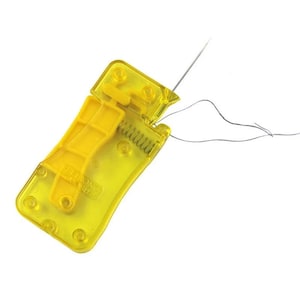 May include: A yellow needle threader with a hinged design. The tool has a spring and a lever for easy use. A needle is inserted through the threader, with a length of thread visible.