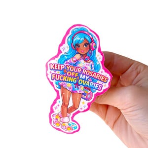 May include: A pink sticker featuring a cartoon girl with blue hair and headphones. The girl is wearing a colorful outfit and holding a boombox. Text on the sticker reads "KEEP YOUR ROSARIES OFF MY FUCKING OVARIES."