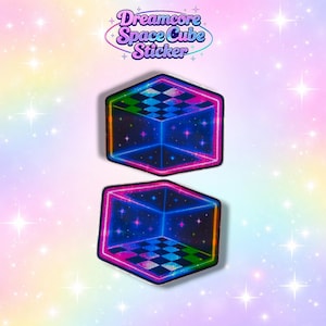 May include: Two hexagonal stickers featuring a Dreamcore Space Cube design. Each sticker displays a three-dimensional cube with a dark blue space background, colorful stars, and a checkered floor pattern in shades of blue, green, and purple.