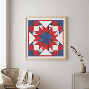 May include: A square framed wall art piece featuring a geometric star pattern in red, white, and blue. The design consists of a central dark blue star surrounded by red and white triangles and squares, with small blue dot accents on white sections.