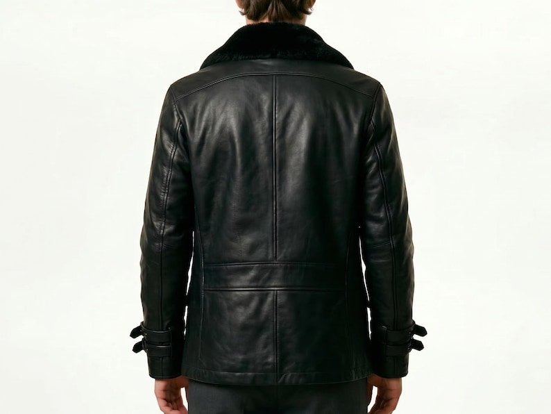 May include: Black leather jacket with a black fur collar. The jacket has a double-breasted design with two rows of buttons, two side pockets, and adjustable cuffs. The jacket is a classic style.