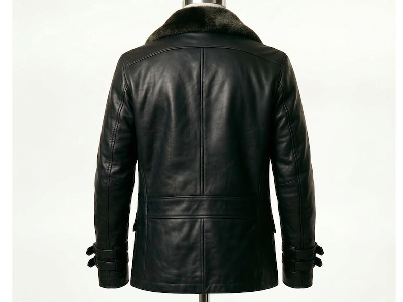 May include: Black leather jacket with a faux fur collar. The jacket has a double-breasted design, two front pockets, and adjustable cuffs. The back view shows a tailored fit, suitable for cold weather.