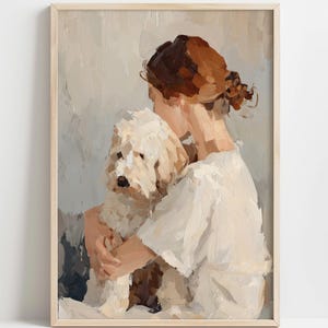 Könnte beinhalten: Ein Ölgemälde in einem hellen Holzrahmen zeigt eine Person mit kastanienbraunem Haar in einem Dutt, die ein weißes Hemd trägt und einen flauschigen weißen Hund umarmt. Das Kunstwerk verwendet sichtbare, strukturierte Pinselstriche in Creme und Beige.