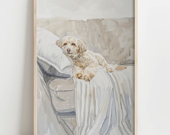 May include: Watercolor painting of a small, light-colored dog resting on a sofa. The dog is lying on a pillow and a striped blanket. The artwork is framed in a light wood frame, with soft, neutral tones.