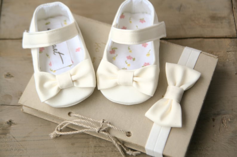 Baby’s christening white dress with beaded flower slipper shoe and head band