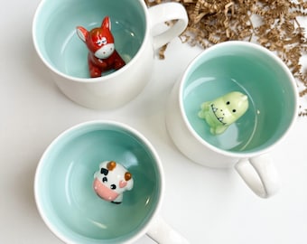 Taza de cerámica con sorpresa animal