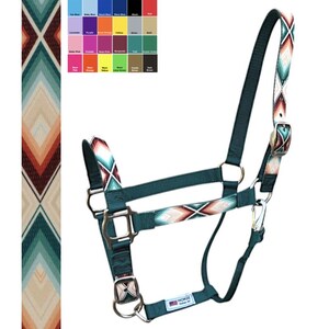 May include: A teal horse halter with a colorful geometric pattern on the noseband and cheek pieces. The halter has silver-colored metal hardware and a label that reads "HORSE Halter All". A color chart is in the upper left corner.