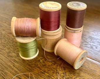 Antique wooden spools with original threads pick your color group . Varying sizes .