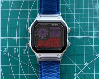 Casio AE1200 Watch with Red and Purple Filters and Blue Band Custom Mods
