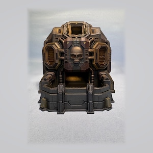 May include: A miniature sci-fi bunker structure featuring a central human skull emblem, dark metallic brown and grey weathered paint, side ventilation ports, and a fortified front wall with two small turret-like protrusions on the base.