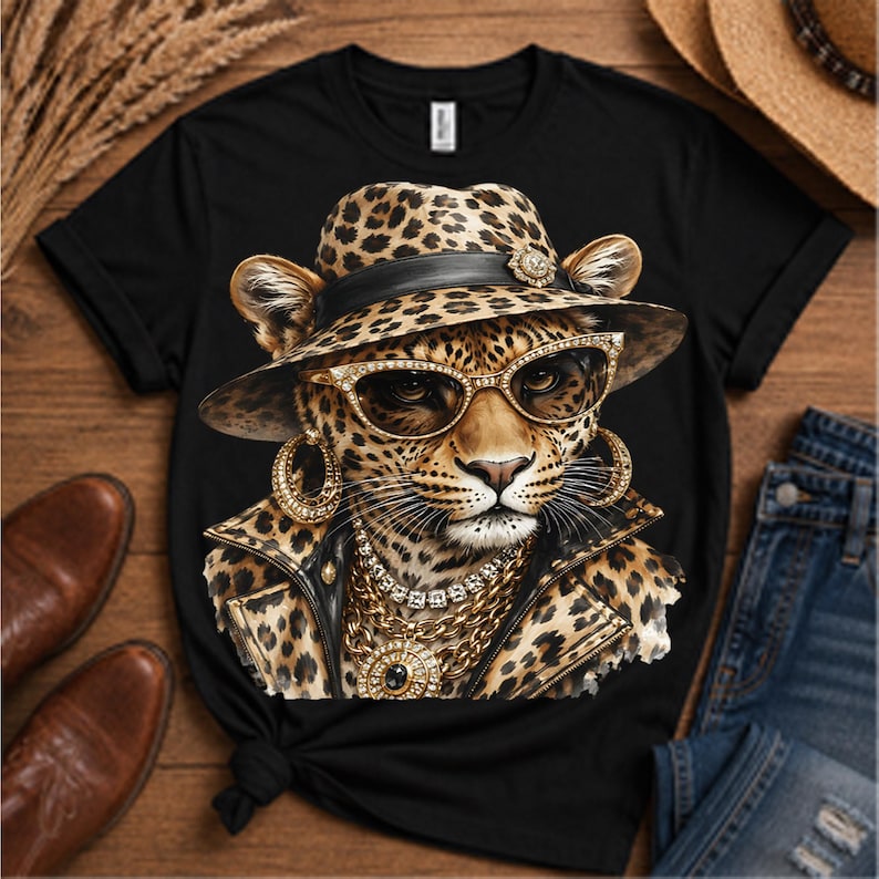 May include: A black t-shirt featuring a graphic print of a leopard wearing a leopard-print fedora, gold-rimmed sunglasses, large gold hoop earrings, a layered gold chain necklace with a central pendant, and a leopard-print jacket with a black collar.