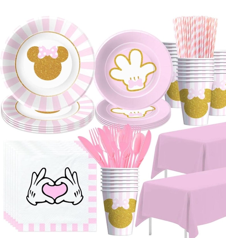 May include: A white ceramic mug with a black handle and the text "But First, Coffee" in a black, bold font. The mug is on a white surface.