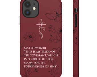 Pode incluir: Capa de telefone bordô com uma cruz branca e design floral, uma borboleta e o texto "MATEUS 26:28 'ESTE É O MEU SANGUE DA ALIANÇA, QUE É DERRAMADO POR MUITOS PARA REMISSÃO DOS PECADOS'".