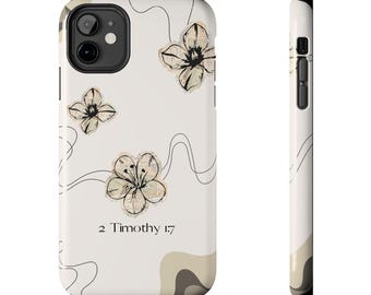 Pode incluir: Capa de telefone branca com um design floral em preto e bege. A capa apresenta o texto "2 Timothy 1:7" e arte de linha preta. A capa tem um design protetor e um acabamento fosco. As flores são em tons de bege e preto.
