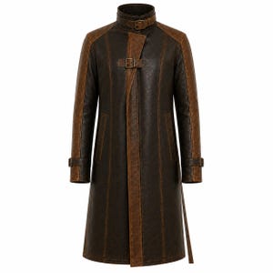 May include: A brown leather trench coat with a high collar and buckle details. The coat features contrasting brown panels on the shoulders and along the front. It has a long, tailored silhouette with a belt at the waist and cuffs.