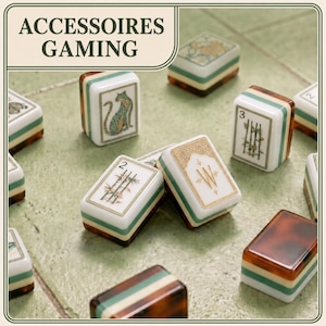 May include: A collection of rectangular mahjong tiles featuring white faces with various illustrations including a leopard, bamboo stalks, and the letter W, layered with green and brown tortoiseshell-style bases. Text reads ACCESSOIRES GAMING.