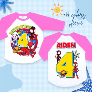 May include: White and pink raglan-style t-shirts featuring Spider-Man characters. One shirt says "BIRTHDAY BOY 4" with Spider-Man graphics. The other shirt says "AIDEN" and "4" with Spider-Man graphics. The shirts have pink sleeves.