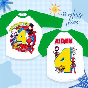 May include: White and green raglan-style birthday shirt featuring Spider-Man characters. The front displays "BIRTHDAY BOY" and the number "4". The back of the shirt has the name "AIDEN" and the number "4".