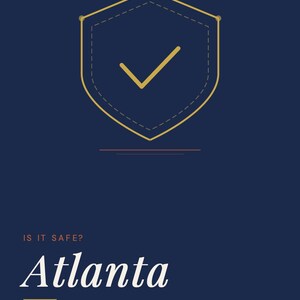 May include: A dark blue informational graphic titled GoingSolo.Life Safety Guide Series. It features a gold shield icon with a checkmark, the text IS IT SAFE? Atlanta, Solo Traveler Safety Guide, and the tagline Travel Alone. Live Fully.