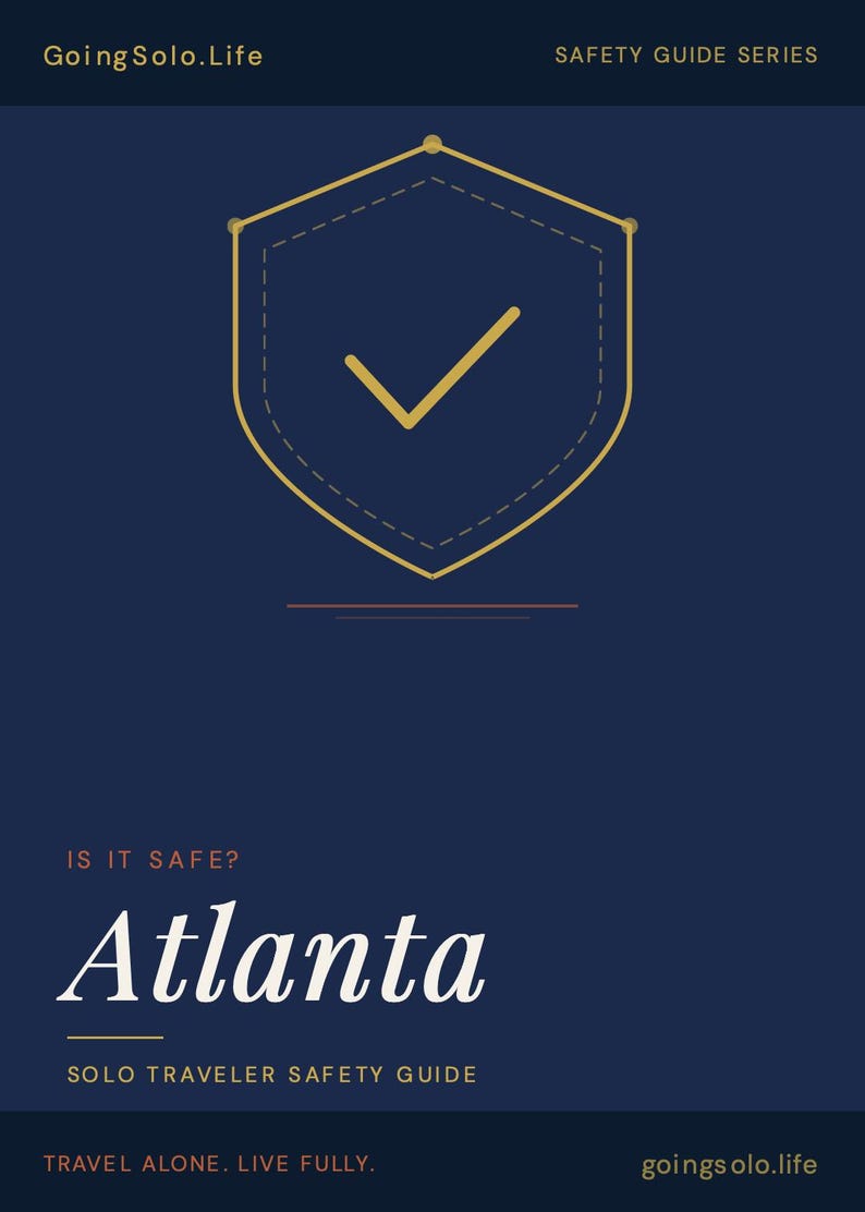 May include: A dark blue informational graphic titled GoingSolo.Life Safety Guide Series. It features a gold shield icon with a checkmark, the text IS IT SAFE? Atlanta, Solo Traveler Safety Guide, and the tagline Travel Alone. Live Fully.