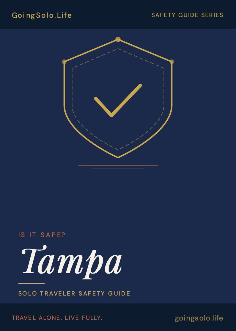 Puede incluir: Un gr&aacute;fico informativo azul oscuro titulado GoingSolo.Life Safety Guide Series. Presenta un icono de escudo dorado con una marca de verificaci&oacute;n, el texto IS IT SAFE? Tampa, Solo Traveler Safety Guide, y el pie de p&aacute;gina Travel Alone. Live Fully. goingsolo.life.