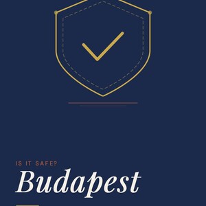 May include: A navy blue travel safety guide cover with the text "Going Solo.Life" and "Safety Guide Series" at the top. The title "Budapest" is in large white script. A gold shield with a checkmark is in the centre. The text "Solo Traveler Safety Guide" is below the title.