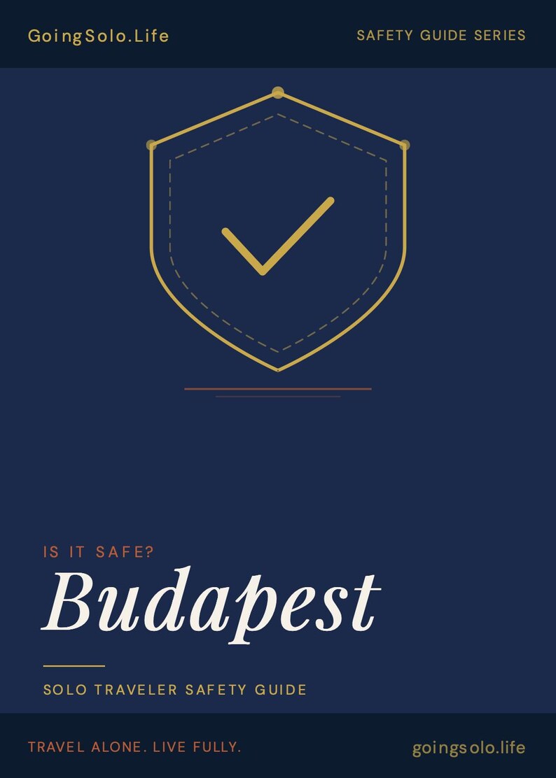 May include: A navy blue travel safety guide cover with the text "Going Solo.Life" and "Safety Guide Series" at the top. The title "Budapest" is in large white script. A gold shield with a checkmark is in the centre. The text "Solo Traveler Safety Guide" is below the title.