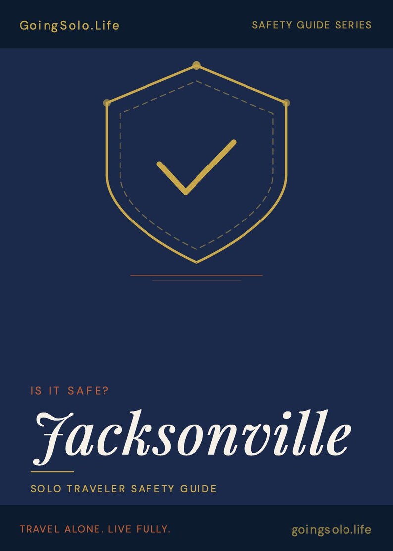 Pu&ograve; includere: Una guida informativa blu scuro intitolata GoingSolo.Life Safety Guide Series. Il centro presenta un'icona a forma di scudo dorato con un segno di spunta. Il testo recita: IS IT SAFE? Jacksonville, SOLO TRAVELER SAFETY GUIDE, TRAVEL ALONE. LIVE FULLY. goingsolo.life.
