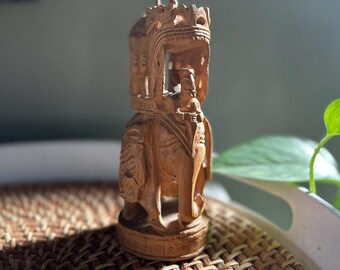 Hand-carved wooden elephant figurine from India
