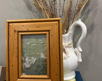 Vintage-style impressionist print featuring geese in rustic wooden frame