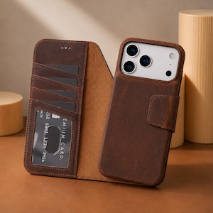 May include: A dark brown leather wallet phone case featuring a tri-fold design with multiple interior card slots and a clear ID window. The exterior has a magnetic closure tab and a cutout for a triple-lens camera system on the back of the phone.