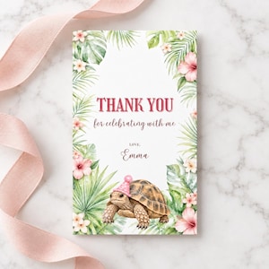 May include: A rectangular thank you card featuring a watercolor illustration of a brown tortoise wearing a pink party hat. The card is framed by green tropical palm leaves and pink hibiscus flowers, with the text THANK YOU for celebrating with me LOVE, Emma.