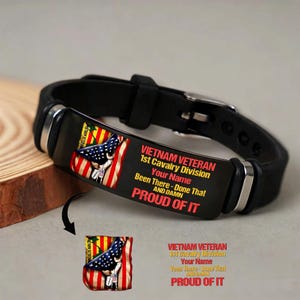May include: Black leather bracelet with a metal plate featuring a US flag design and text that reads "VIETNAM VETERAN 1st Cavalry Division". The text also includes "Been There - Done That AND DAMN PROUD OF IT".