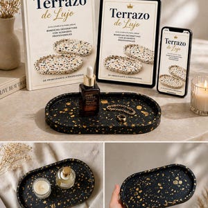 Puede incluir: Una bandeja ovalada negra con motas doradas, que contiene una botella, joyas y un libro titulado "Terrazo de Lujo". El libro, la tableta y el teléfono muestran el mismo título e imágenes de bandejas decorativas.
