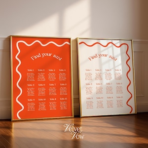 Könnte beinhalten: Zwei gerahmte Sitzpläne für Hochzeiten mit Goldrahmen. Ein Plan hat einen leuchtend orangefarbenen Hintergrund mit weißem Text und einem weißen Wellenrand. Der andere hat einen weißen Hintergrund mit orangefarbenem Text und einem orangefarbenen Wellenrand. Beide tragen die Aufschrift Find your seat.