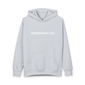 May include: A light gray hoodie with a front pocket and a hood. The text "EPHESIANS 2:10" is printed across the chest in white block letters. The hoodie is made of a soft, comfortable material.