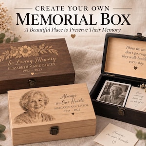 May include: Three rectangular wooden memorial boxes with metal latches. One dark brown box features floral engravings and text "In Loving Memory". A light wood box shows a portrait and "Always in Our Hearts". An open black box displays interior text.