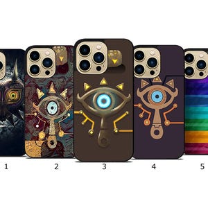 May include: Five phone cases with unique designs. The cases feature various graphics, including an eye symbol, a mask, and abstract patterns. The cases are in shades of brown, purple, and black, with gold and blue accents. The cases are designed for a smartphone.