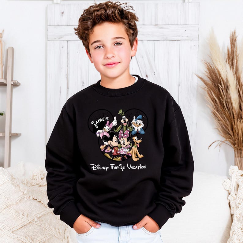 May include: A white ceramic mug with a black handle and the text "But First, Coffee" in a black, handwritten-style font. The mug is on a white surface.