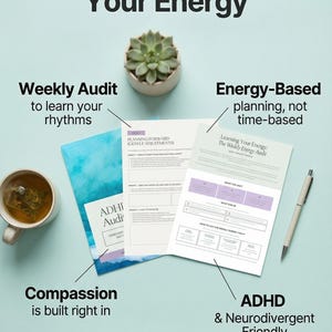 May include: A planner with printed pages featuring text including The Planner That Understands Your Energy, Weekly Audit, and Learning Your Energy. The pages are displayed with a succulent, a cup of tea, and a pen on a light background.