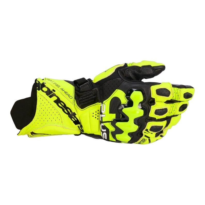 May include: Neon yellow and black motorcycle glove with the brand name "Alpinestars" printed on the cuff. The glove features a perforated design for breathability and a secure wrist strap. The glove is designed for racing.