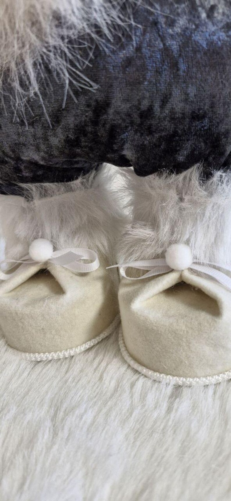 May include: A white ceramic mug with a black handle and the text "But First, Coffee" in a bold, black font. The mug is set against a neutral background, highlighting its simple design.