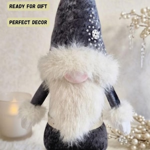 May include: A handmade wooden sign with the text "Welcome to our home" in a handwritten style. The sign is painted white with black lettering and a distressed finish, perfect for home decor.