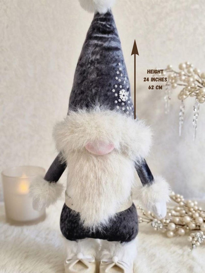 May include: A plush gnome doll with a gray velvet hat and a white faux fur beard and trim. The gnome is 24 inches (62 cm) tall and has a pink nose and white boots. The hat is decorated with sequins.
