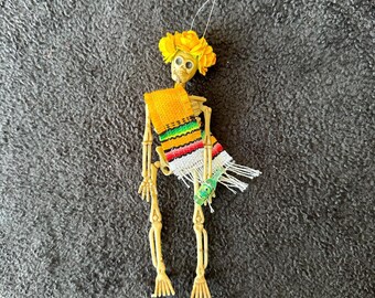 Yellow Sarape day of the dead skeleton ornament with flower crown and tequila