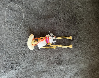 White Sarape day of the dead skeleton ornament with a cola