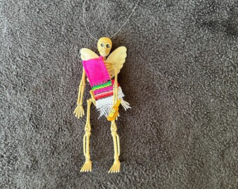 Pink Sarape day of the dead skeleton ornament with wings and a beer #09